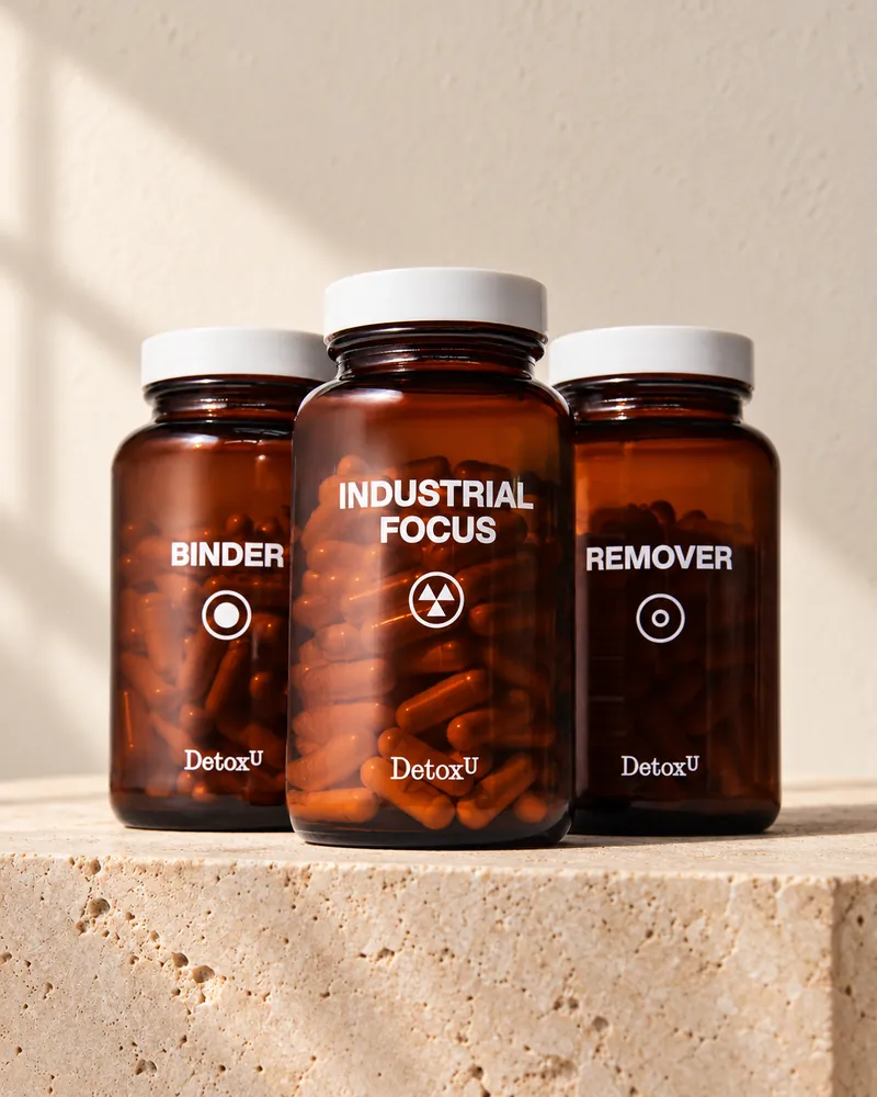 Industrial Focus protocol: Binder, Industrial Focus and Remover bottles on a stone plinth